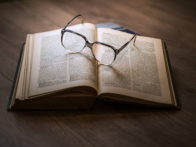 Textbook with glasses