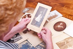 Woman looking at old photos